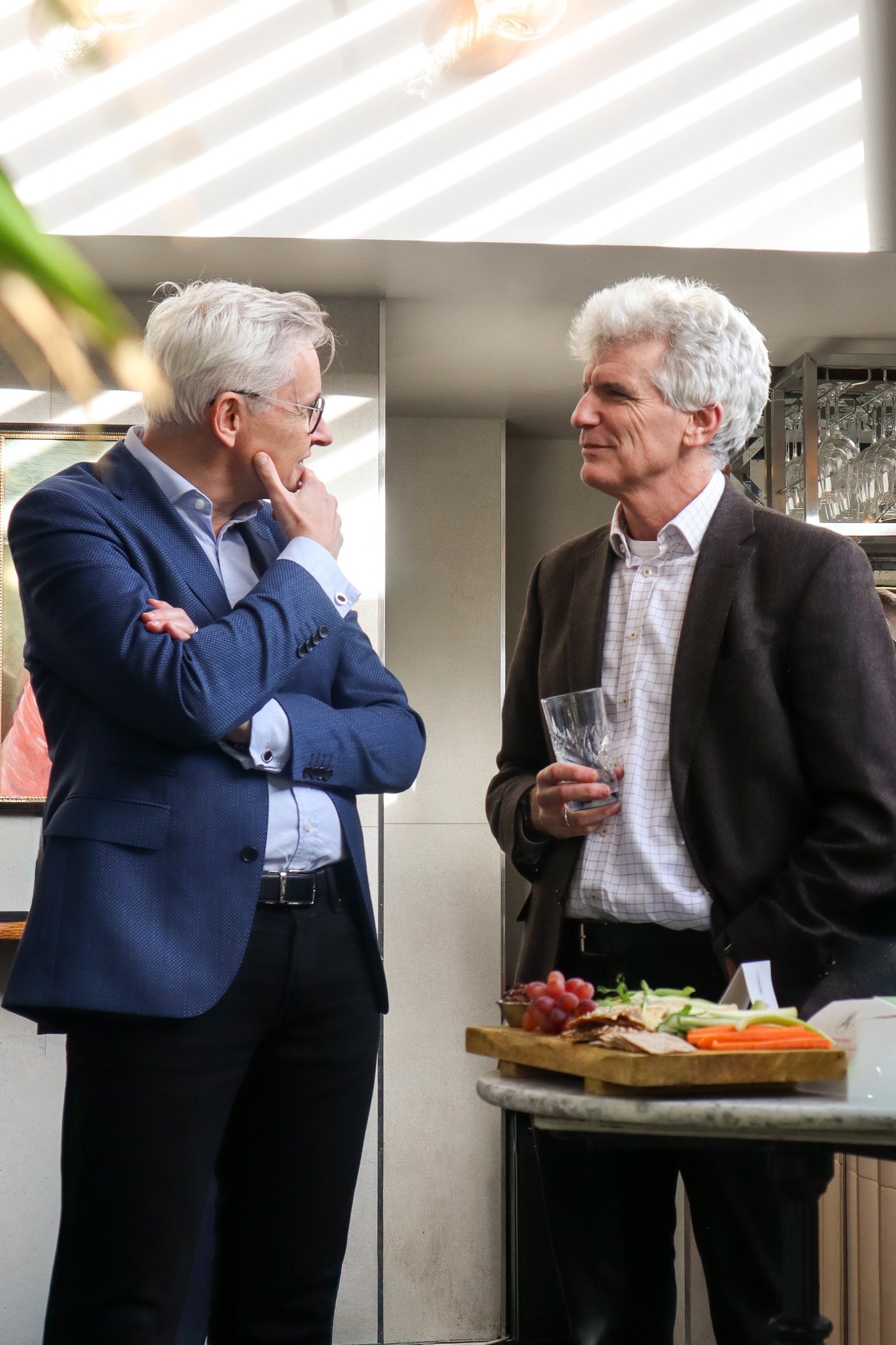 Two guests in conversation at Views & Ventures